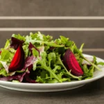 A fresh beetroot salad with arugula, walnuts, and a light vinaigrette.